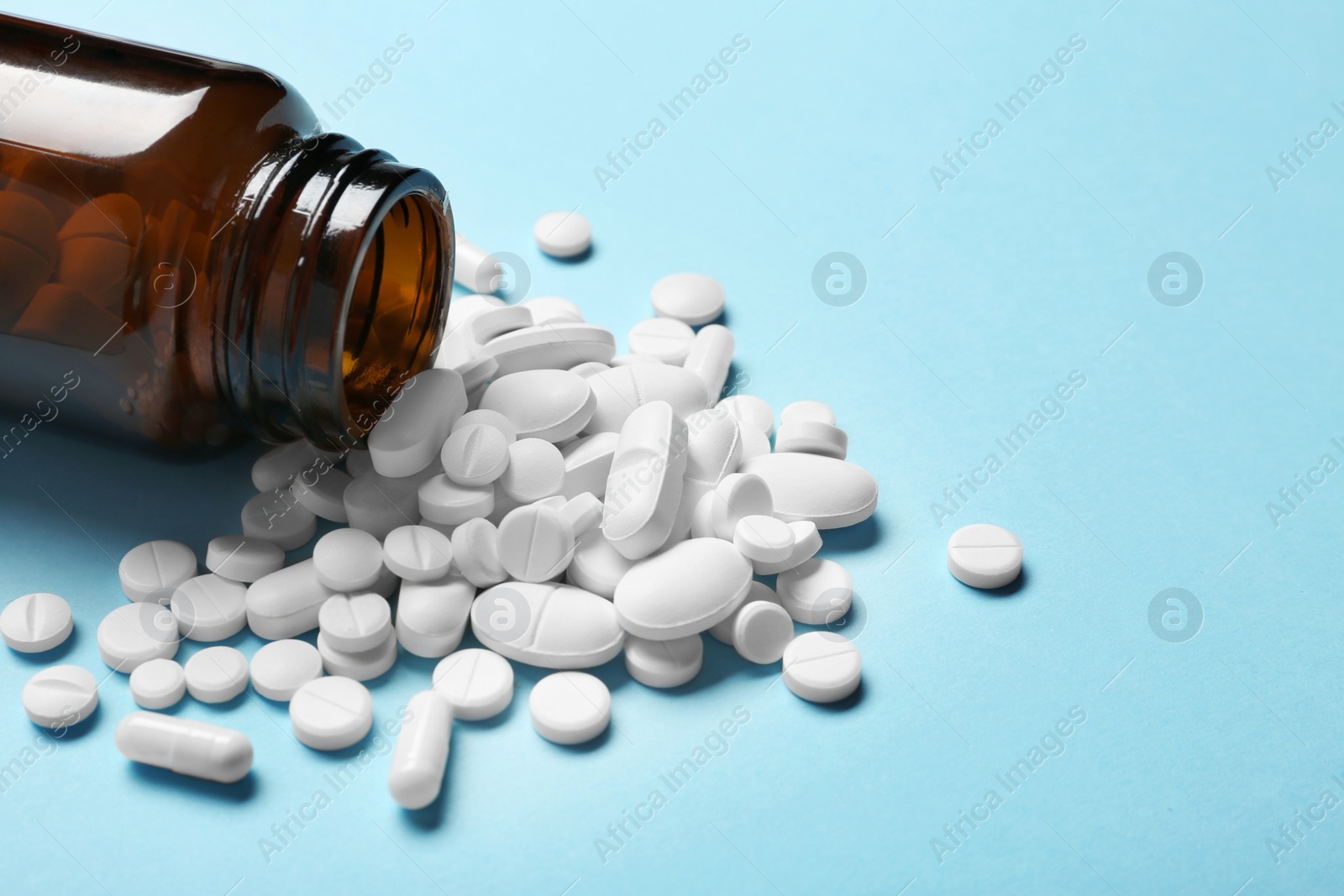 Photo of Bottle with vitamin pills on color background, closeup. Space for text