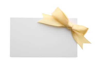 Photo of Gift card with bow isolated on white. Mockup for design