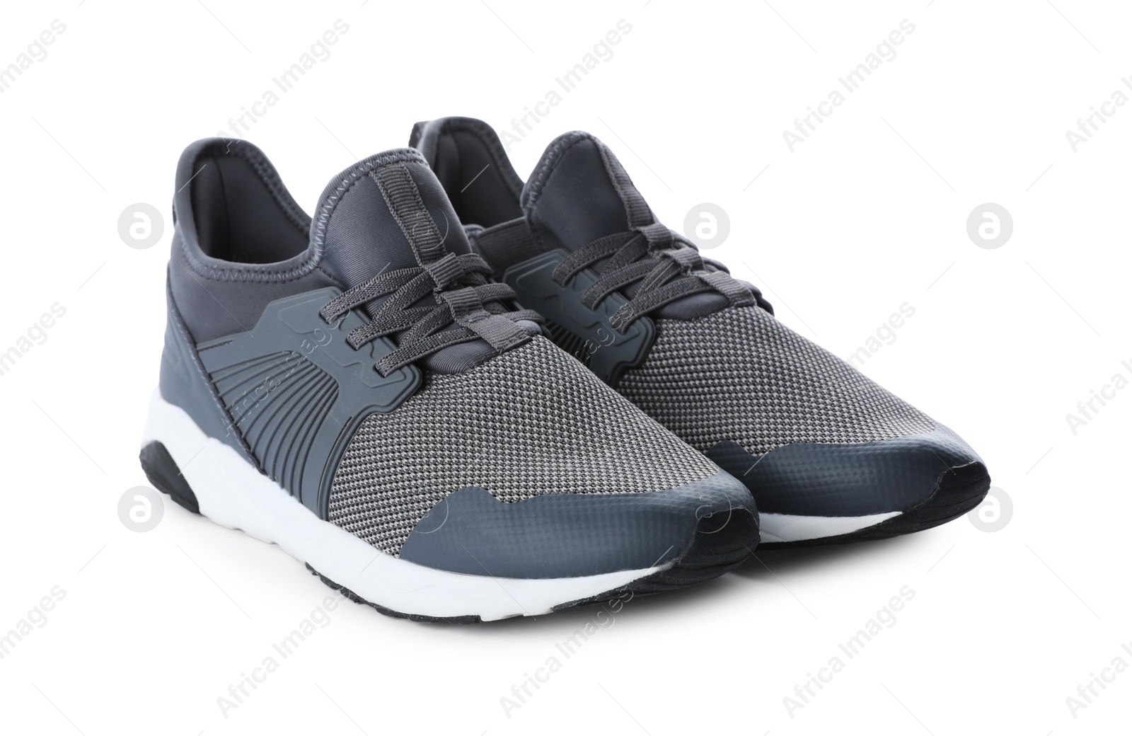 Photo of Pair of stylish grey sneakers on white background