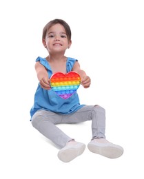 Little girl with pop it fidget toy on white background