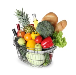 Shopping basket with grocery products on white background