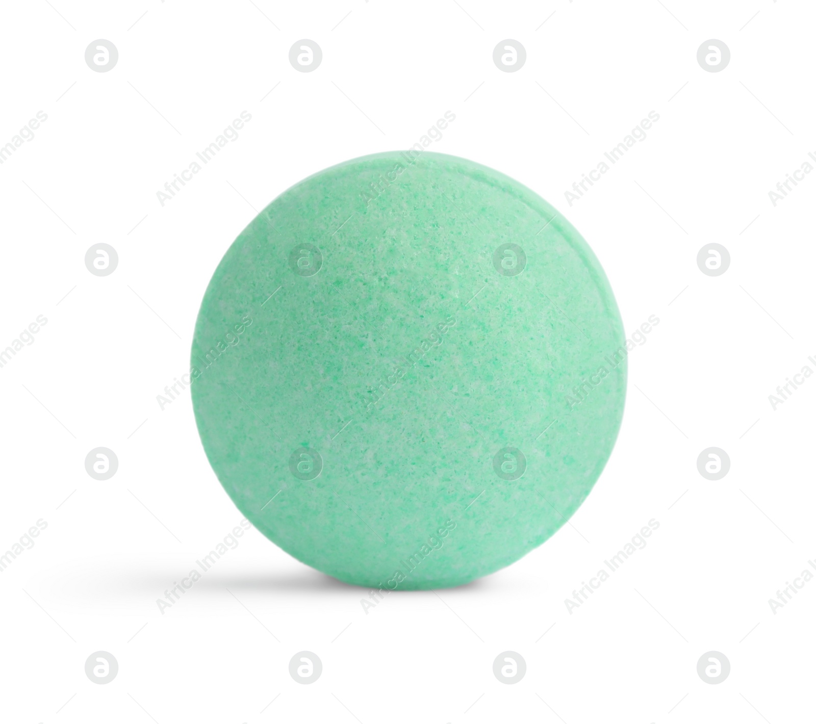 Photo of One light green pill on white background. Medicinal treatment