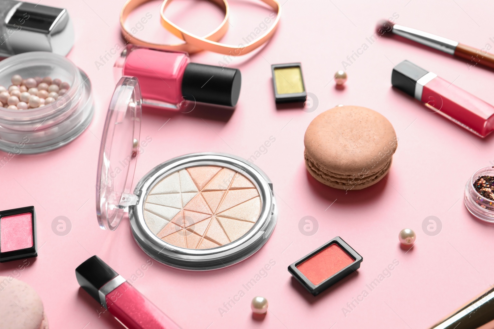 Photo of Decorative cosmetics and tools of professional makeup artist on color background