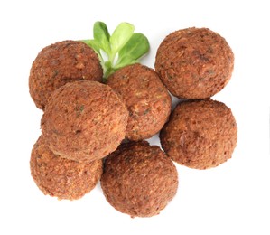 Photo of Delicious falafel balls and lambs lettuce on white background, top view. Vegan meat products