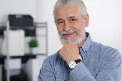 Photo of Portrait of handsome senior man in office. Space for text