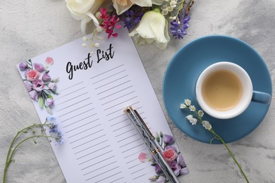 Guest list, coffee, pen and beautiful flowers on light textured table, flat lay. Space for text