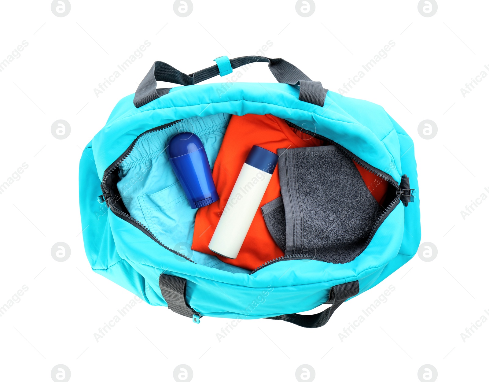 Photo of Sport bag with deodorants and clothes on white background, top view