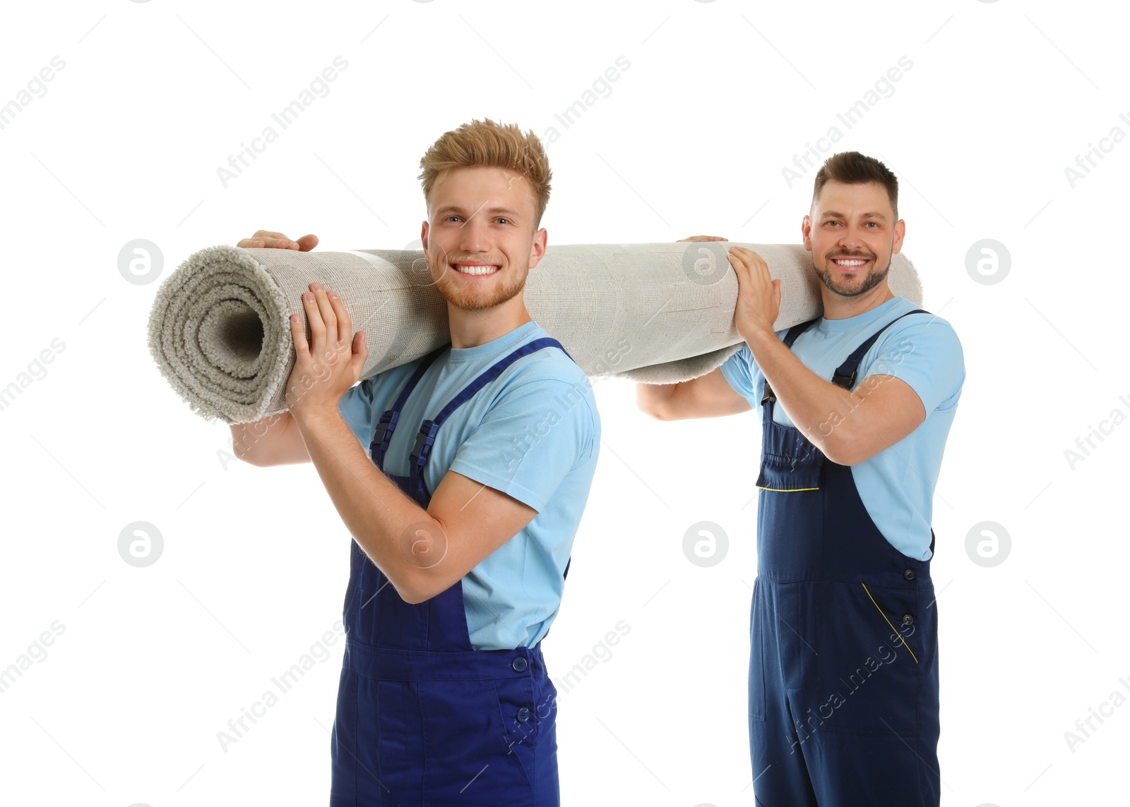 Photo of Portrait of moving service employees with carpet on white background