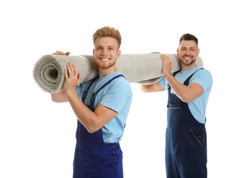 Photo of Portrait of moving service employees with carpet on white background