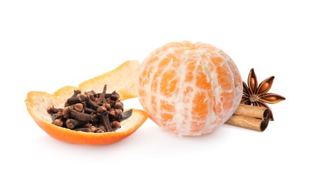 Fresh ripe tangerine, cloves, anise and cinnamon on white background