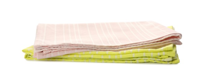 Photo of Pink and yellow kitchen towels on white background