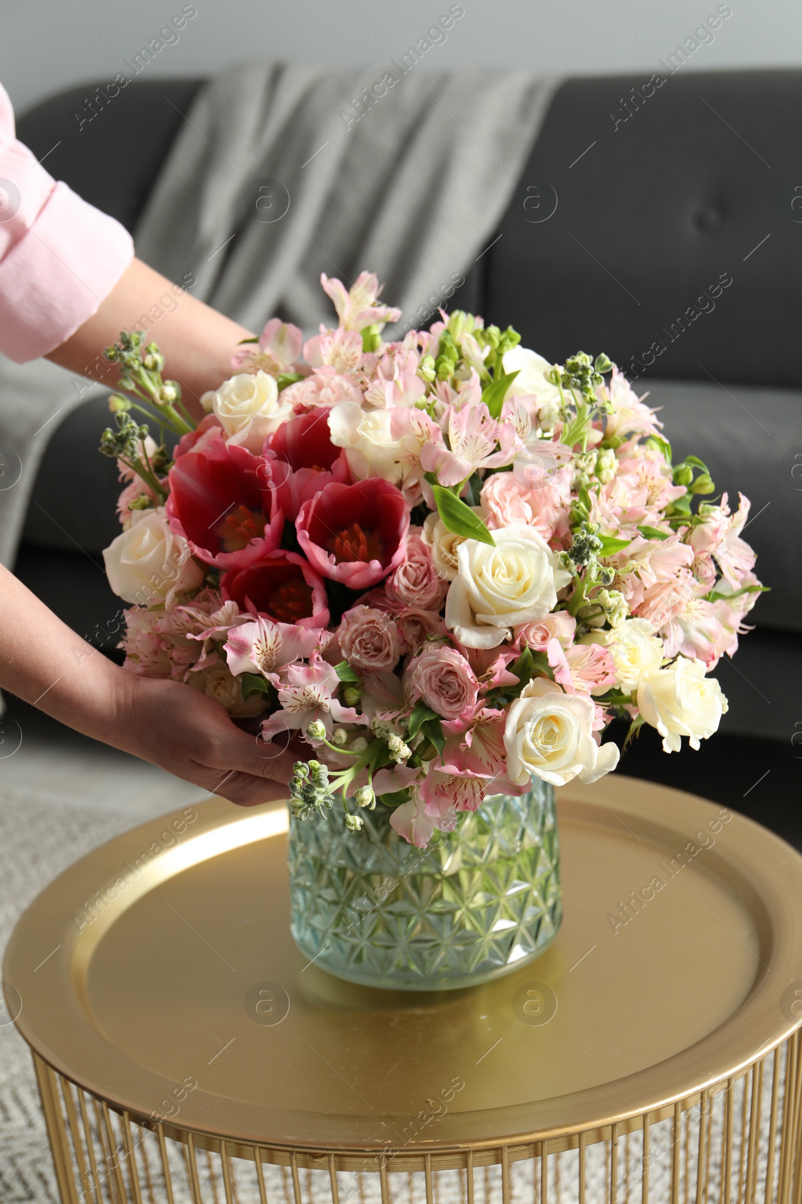 Photo of Woman with beautiful bouquet of fresh flowers indoors, closeup