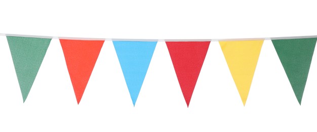 Photo of Bunting with colorful triangular flags on white background. Festive decor