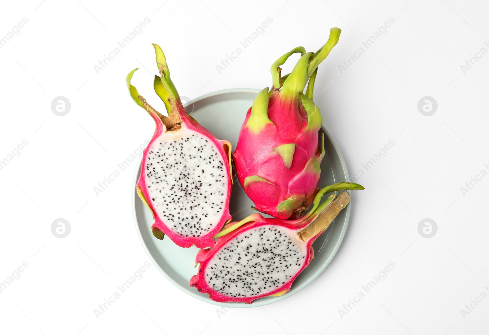 Photo of Delicious cut and whole dragon fruits (pitahaya) on white background, top view