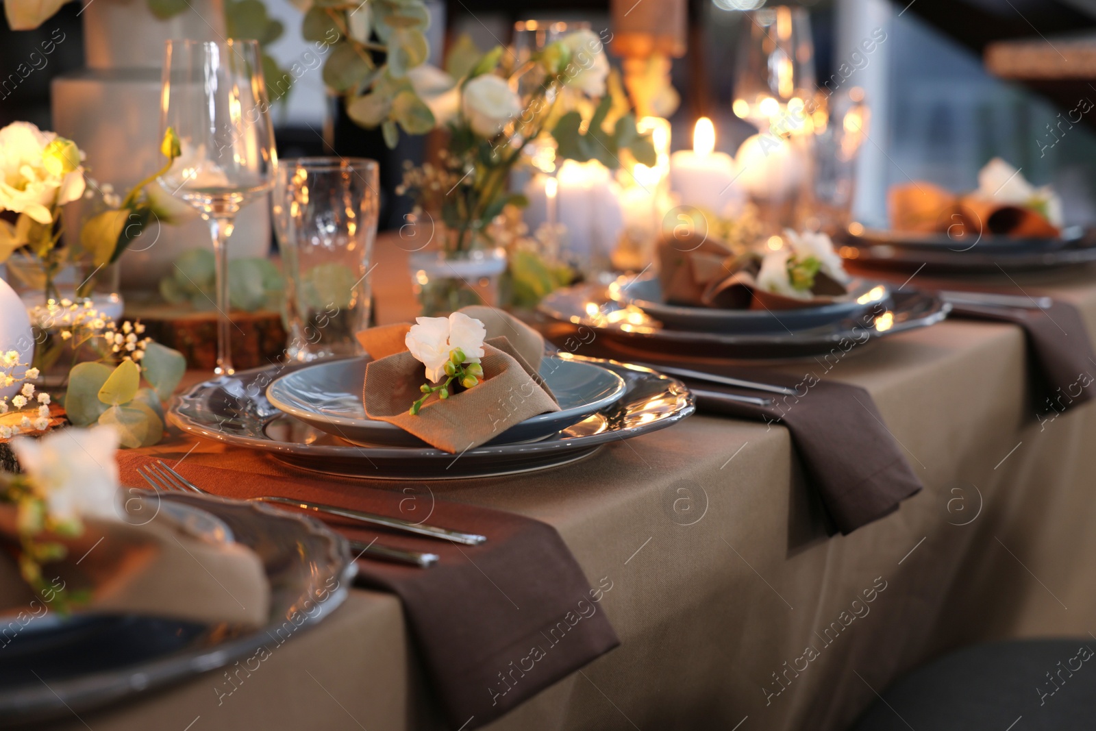 Photo of Elegant table setting with beautiful floral decor