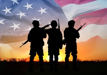 Veterans Day. Silhouettes of military men on sunset outdoors and flag of USA, double exposure