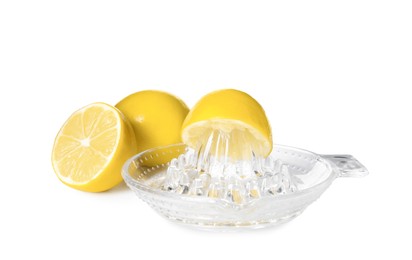 Photo of Plastic juicer and ripe lemons on white background