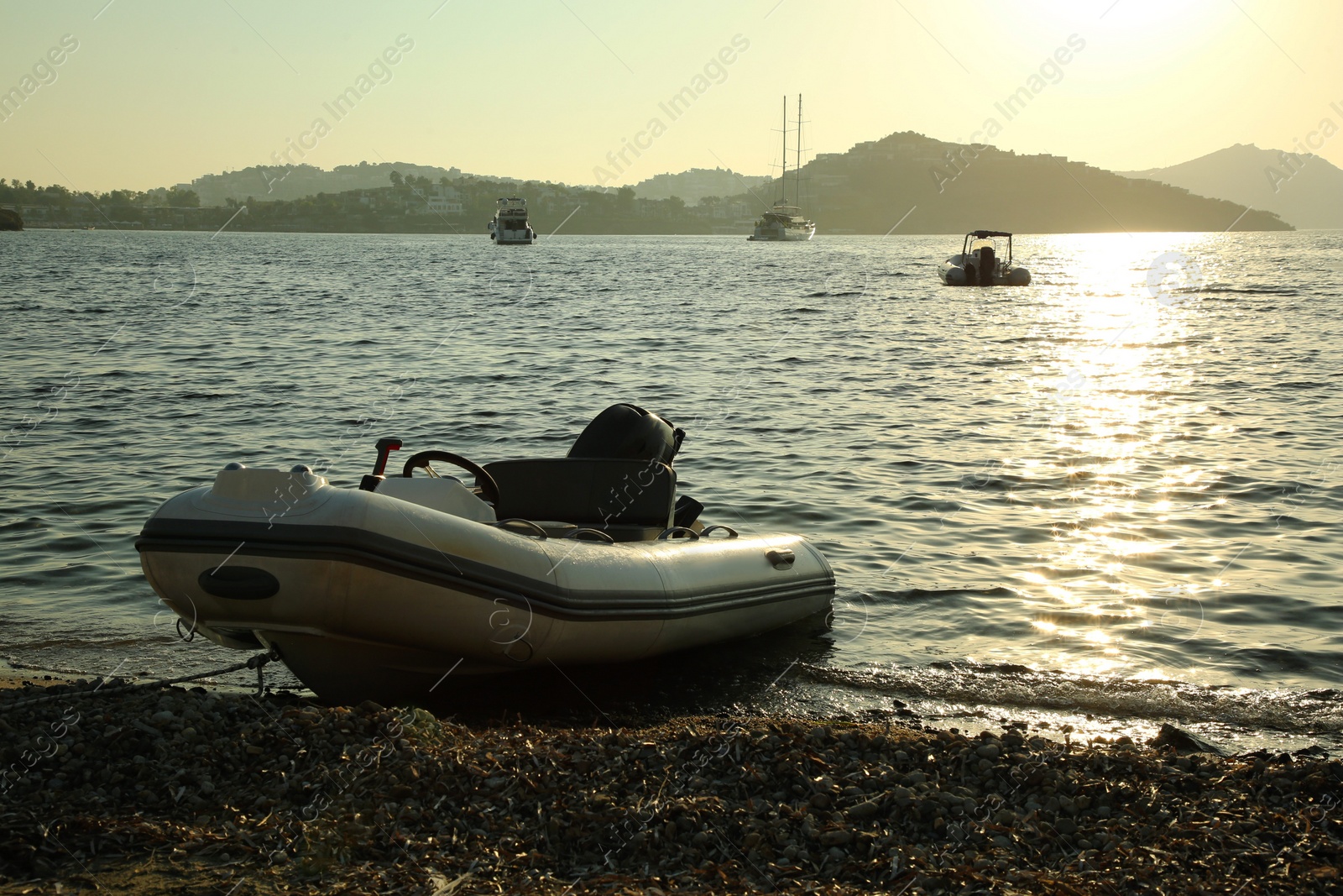 Photo of Beautiful view of calm sea, boats and coastal city on sunny day