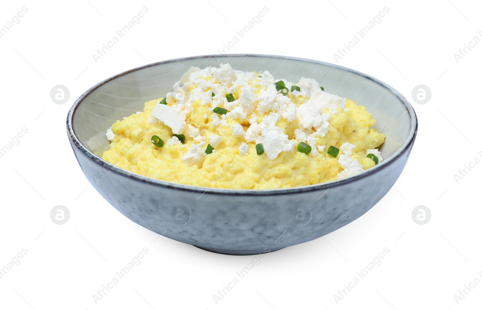 Photo of Tasty banosh with brynza and cut green onions in bowl isolated on white. Traditional Ukrainian dish