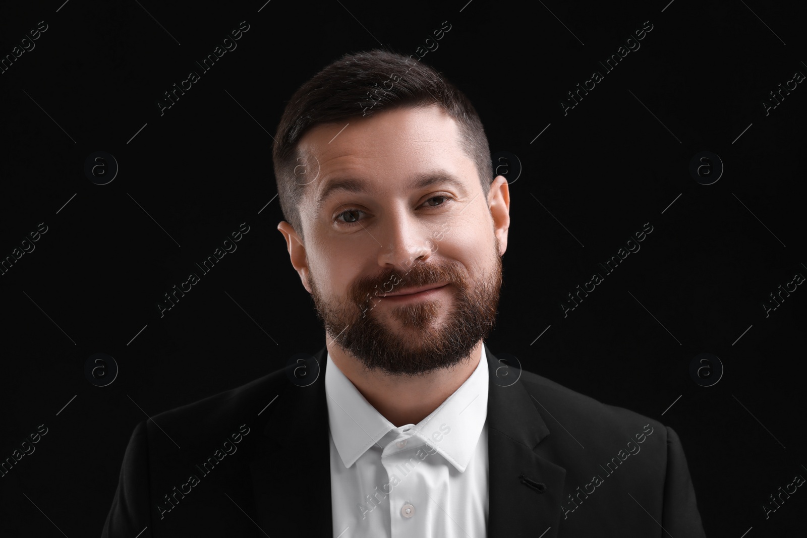 Photo of Personality concept. Portrait of handsome man on black background