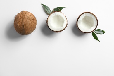 Composition with coconuts on white background, top view