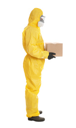 Man wearing chemical protective suit with cardboard box on white background. Prevention of virus spread