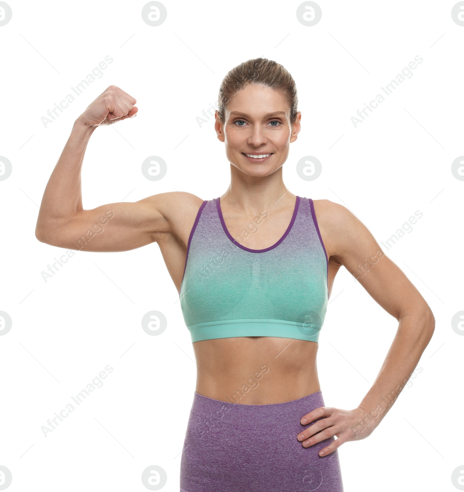 Photo of Portrait of sportswoman showing muscles on white background