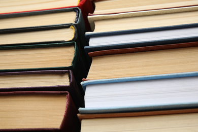 Photo of Many different hardcover books as background, closeup