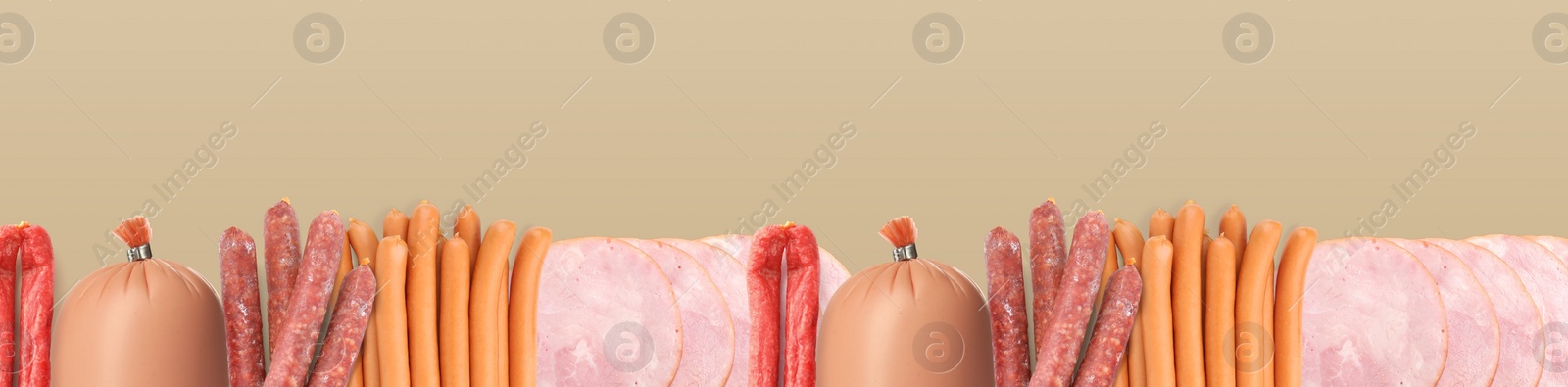 Image of Many different tasty sausages on light brown background, flat lay. Banner design