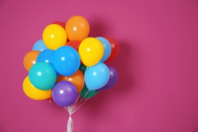 Bunch of bright balloons and space for text against color background