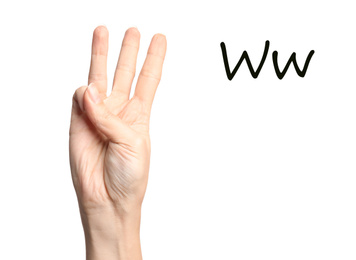Woman showing letter W on white background, closeup. Sign language