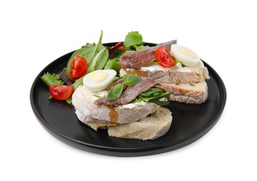 Photo of Delicious bruschettas with anchovies, cream cheese, eggs and tomatoes isolated on white