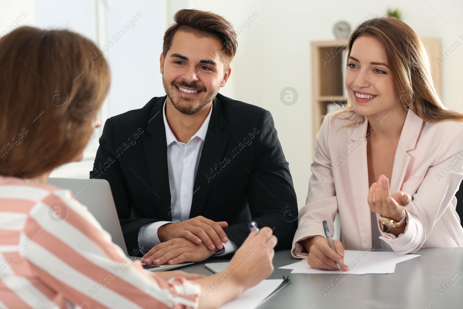 Photo of Human resources commission conducting job interview with applicant in office