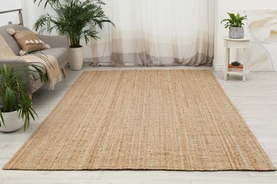 Stylish rug on floor in room. Interior design