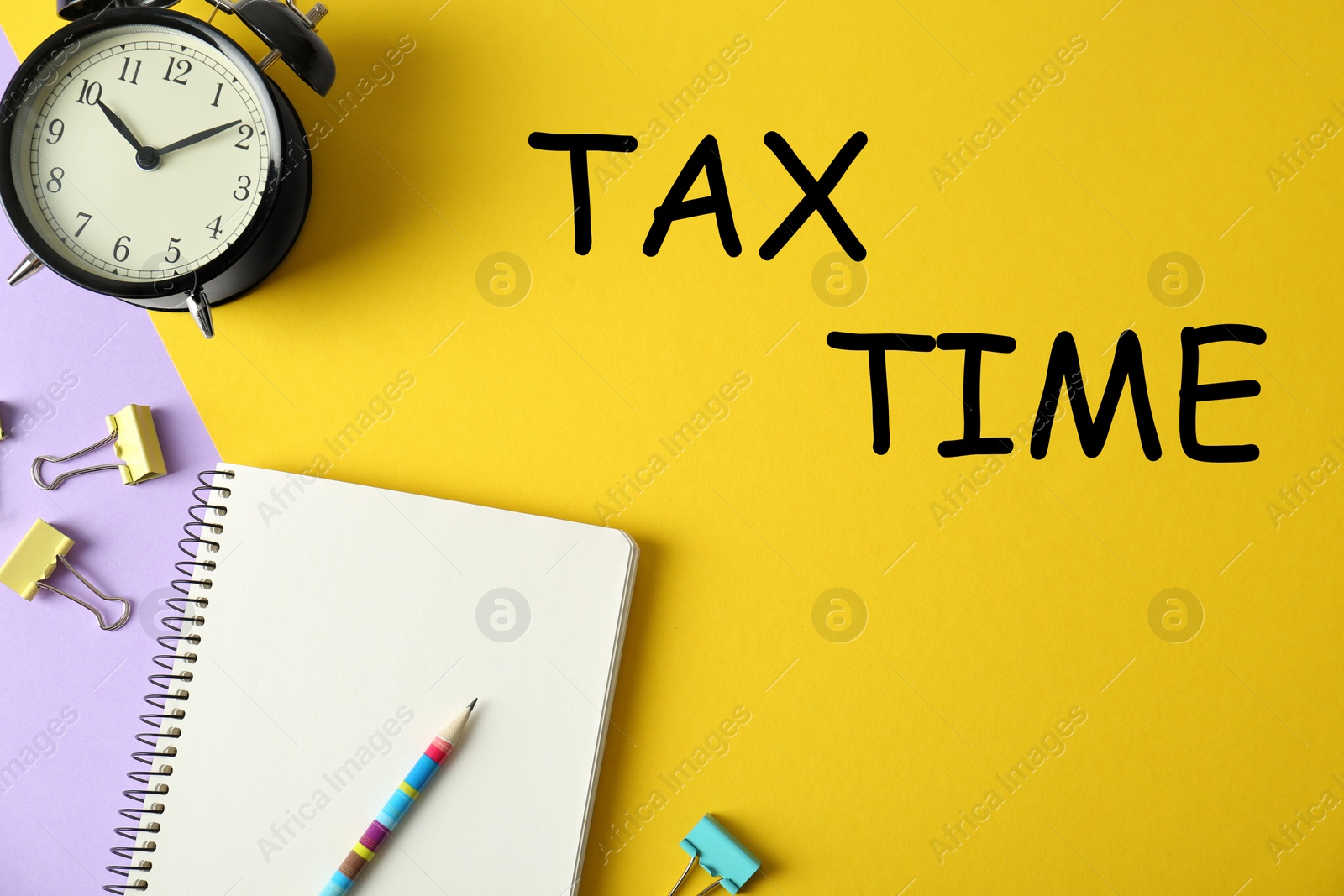 Image of Flat lay composition with stationery on yellow background. Tax time