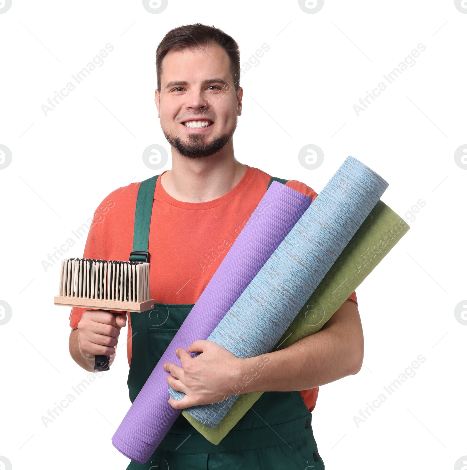 Photo of Man with wallpaper rolls and brush on white background