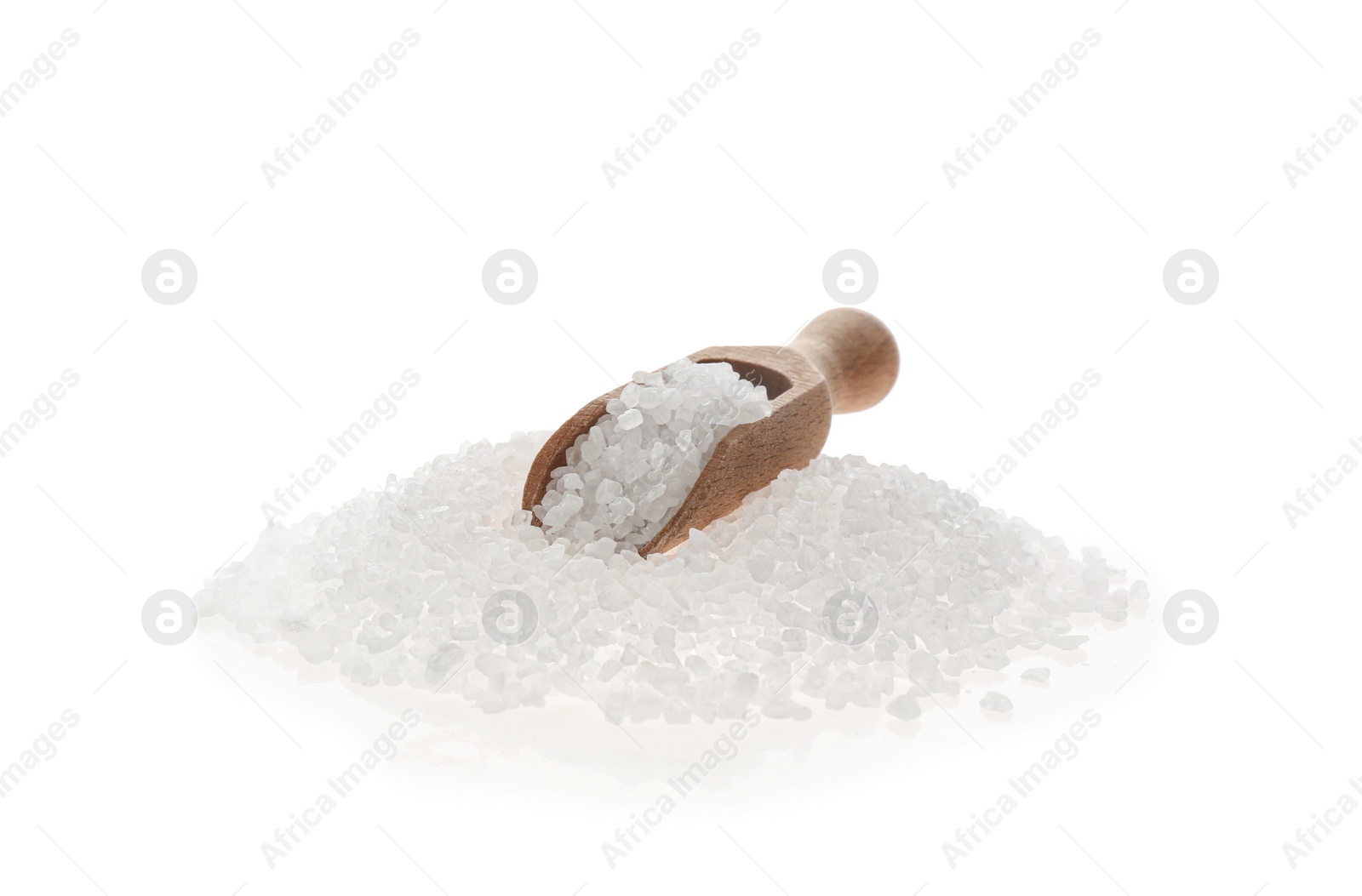 Photo of Wooden scoop with salt isolated on white