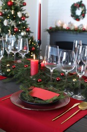 Photo of Elegant Christmas table setting with blank place card and festive decor