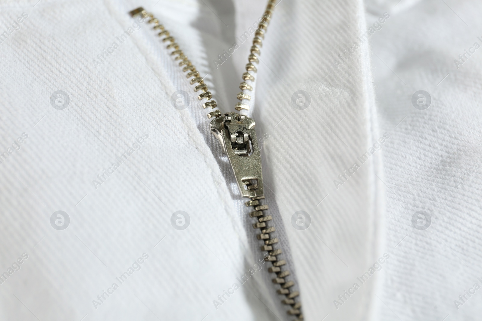 Photo of White jacket with zipper as background, closeup view