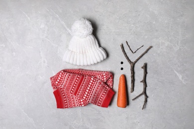 Photo of Set of elements for snowman on light grey marble background, flat lay