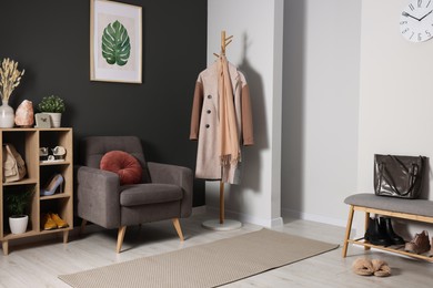 Photo of Modern hallway interior with stylish furniture and decorative elements