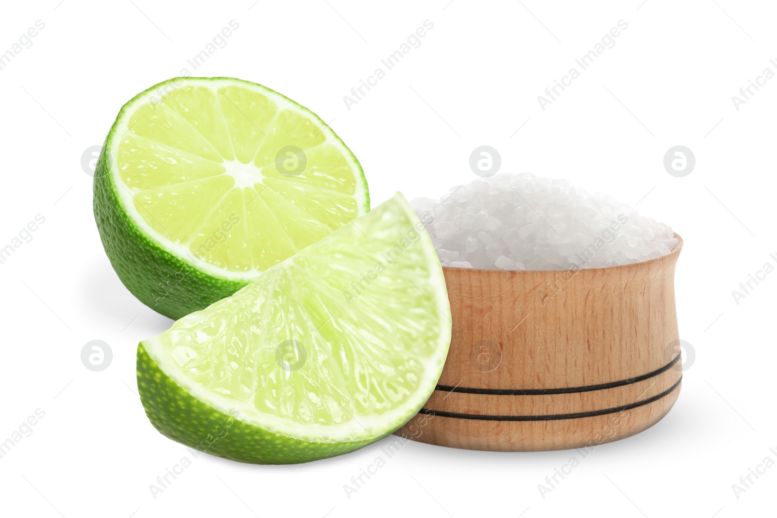 Image of Cut lime and salt isolated on white. Margarita cocktail ingredients