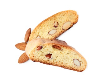 Photo of Slices of tasty cantucci and nuts on white background, top view. Traditional Italian almond biscuits