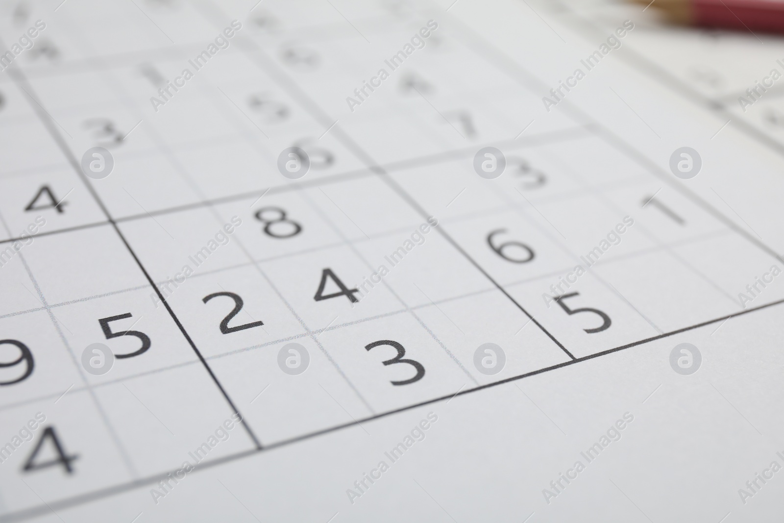 Photo of Sudoku puzzle grid as background, closeup view