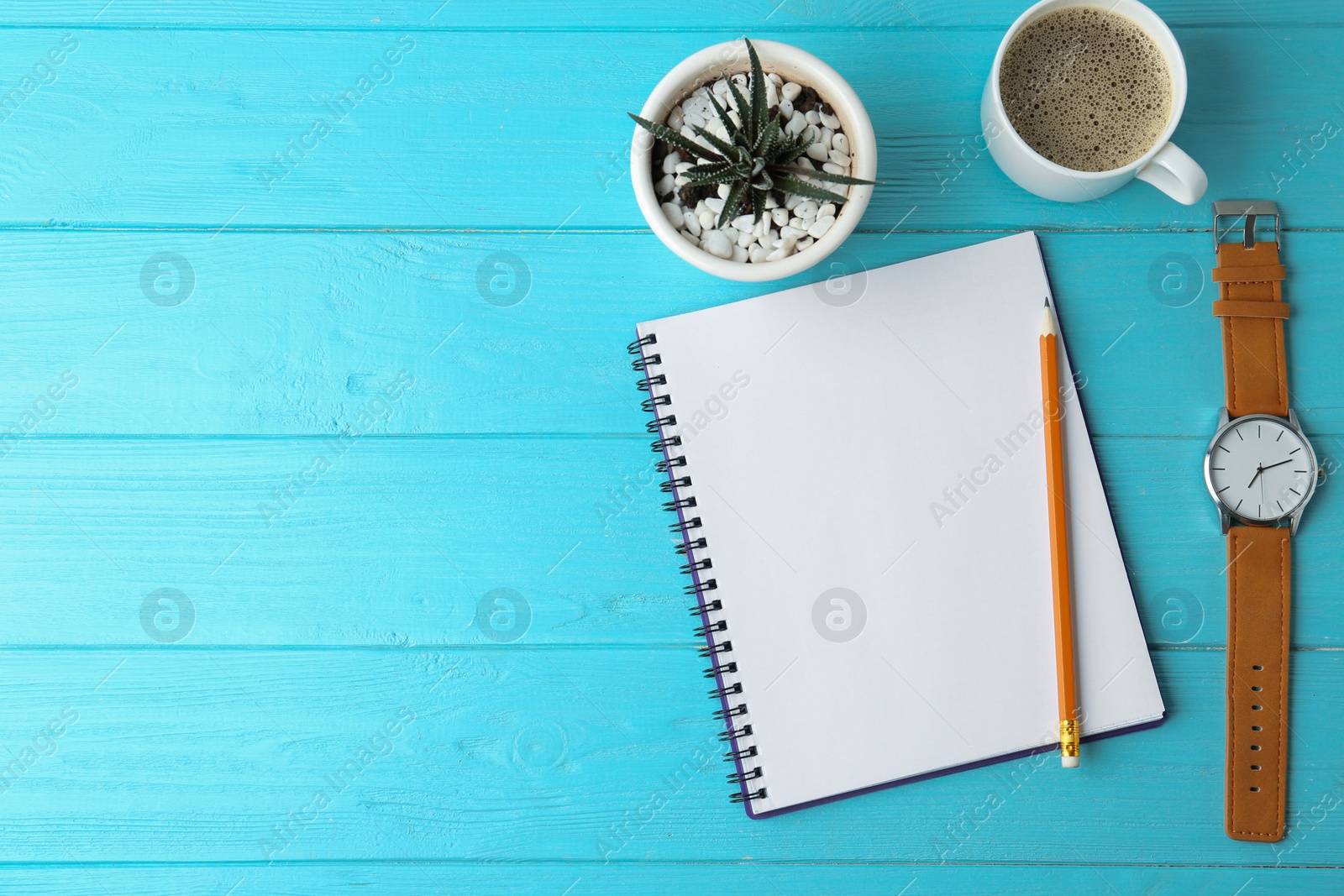 Photo of Flat lay composition with office stationery and cup of coffee on light blue wooden table. Space for text