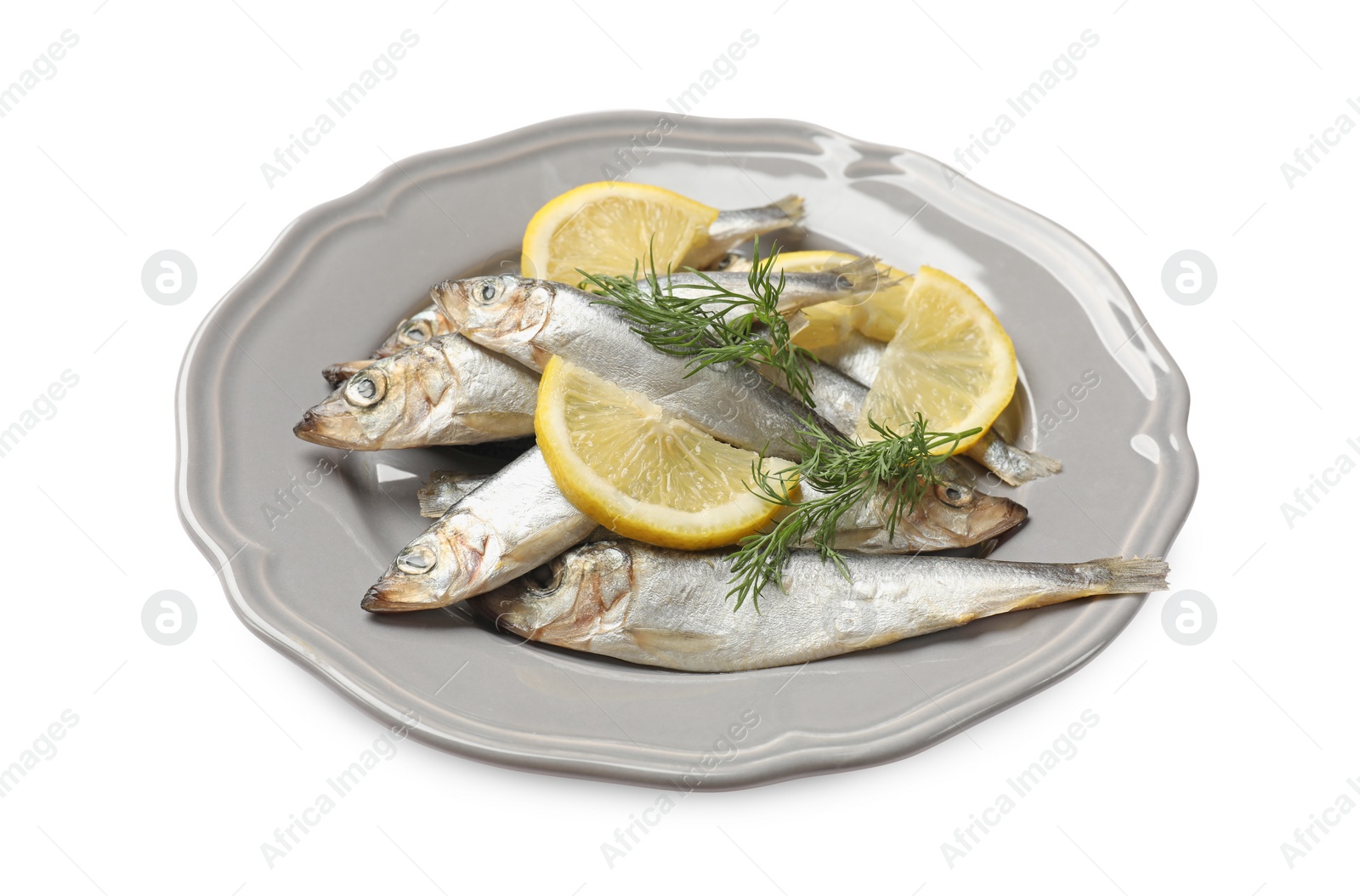 Photo of Fresh raw sprats, dill and cut lemon isolated on white