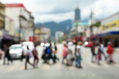 Photo of Blurred view of people on crosswalk in city. Bokeh effect