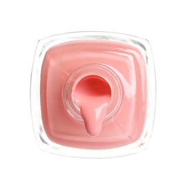 Pouring color nail polish from bottle on white background