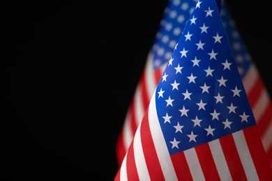 Photo of American flag on black background, closeup with space for text. Memorial Day