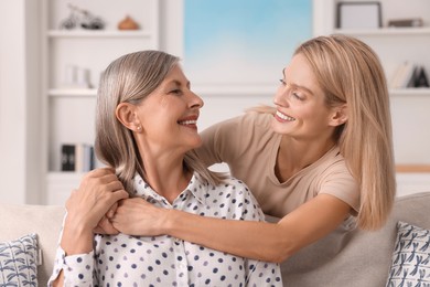 Photo of Happy mature mother and her daughter at home